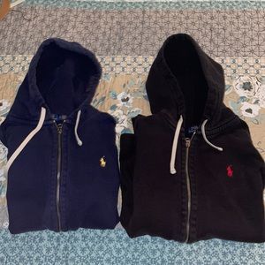 Polo zip-up hoodies, size mediums. Colors are black/red and blue/yellow.
